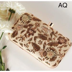 Beautiful clutch with golden embroidery.